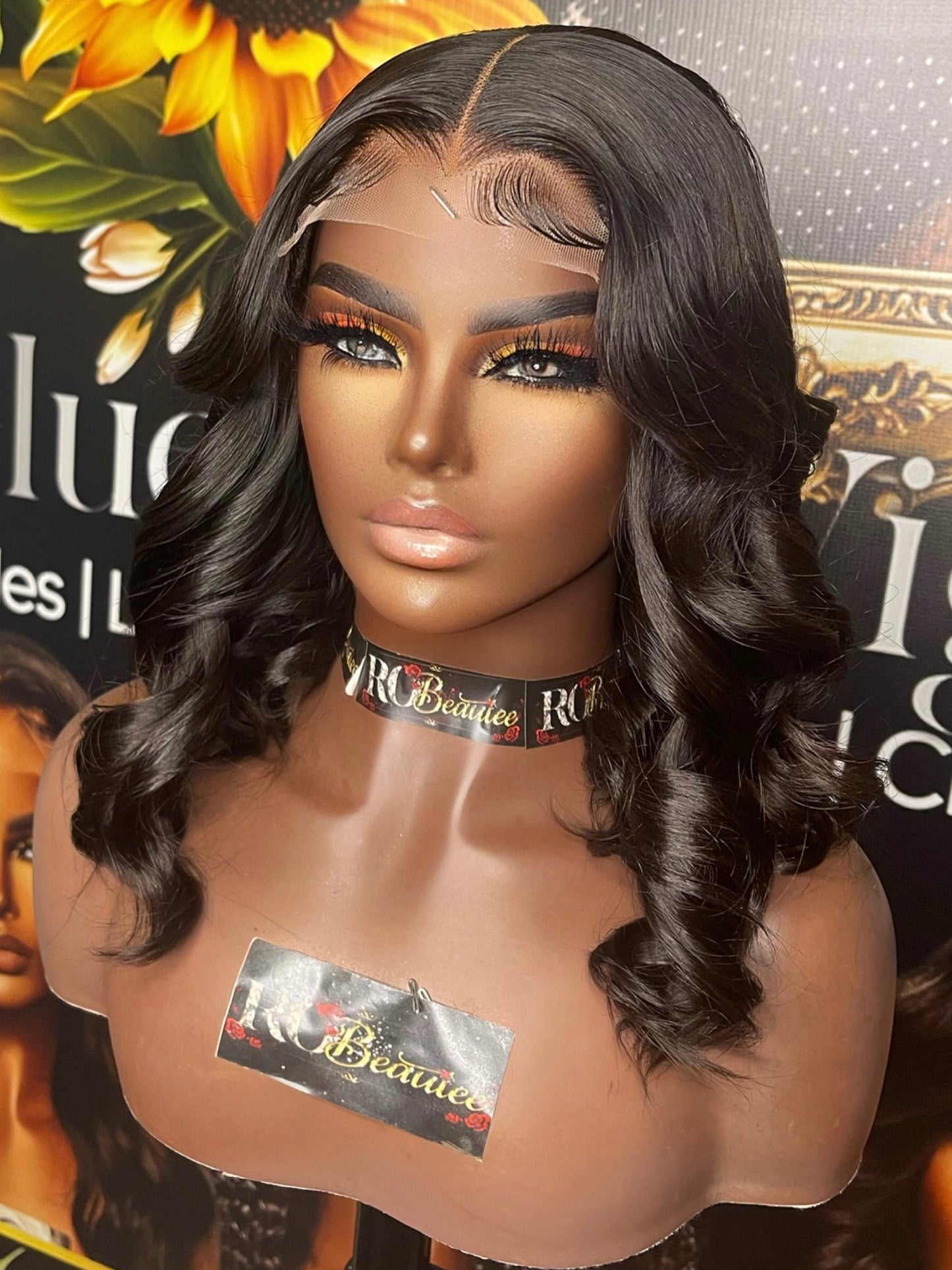 Long black wig with curly ends.