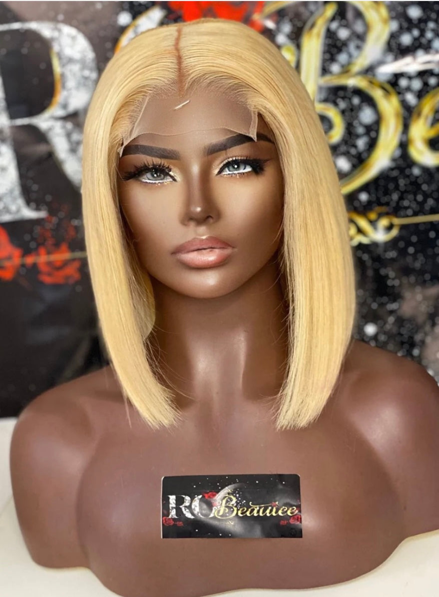 Center part, short hair, bleach blonde wig.