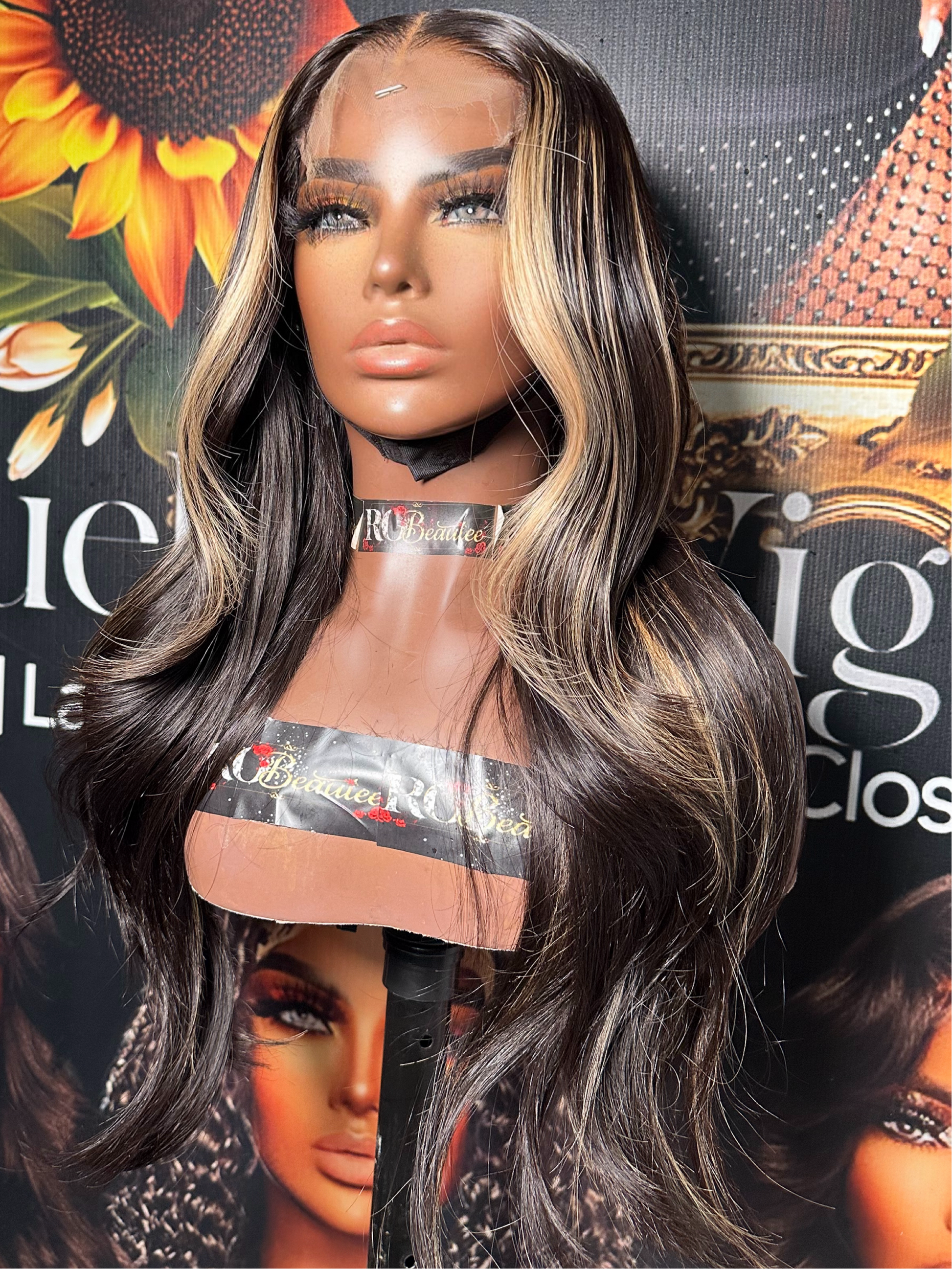 Brunette wig with blond highlights.