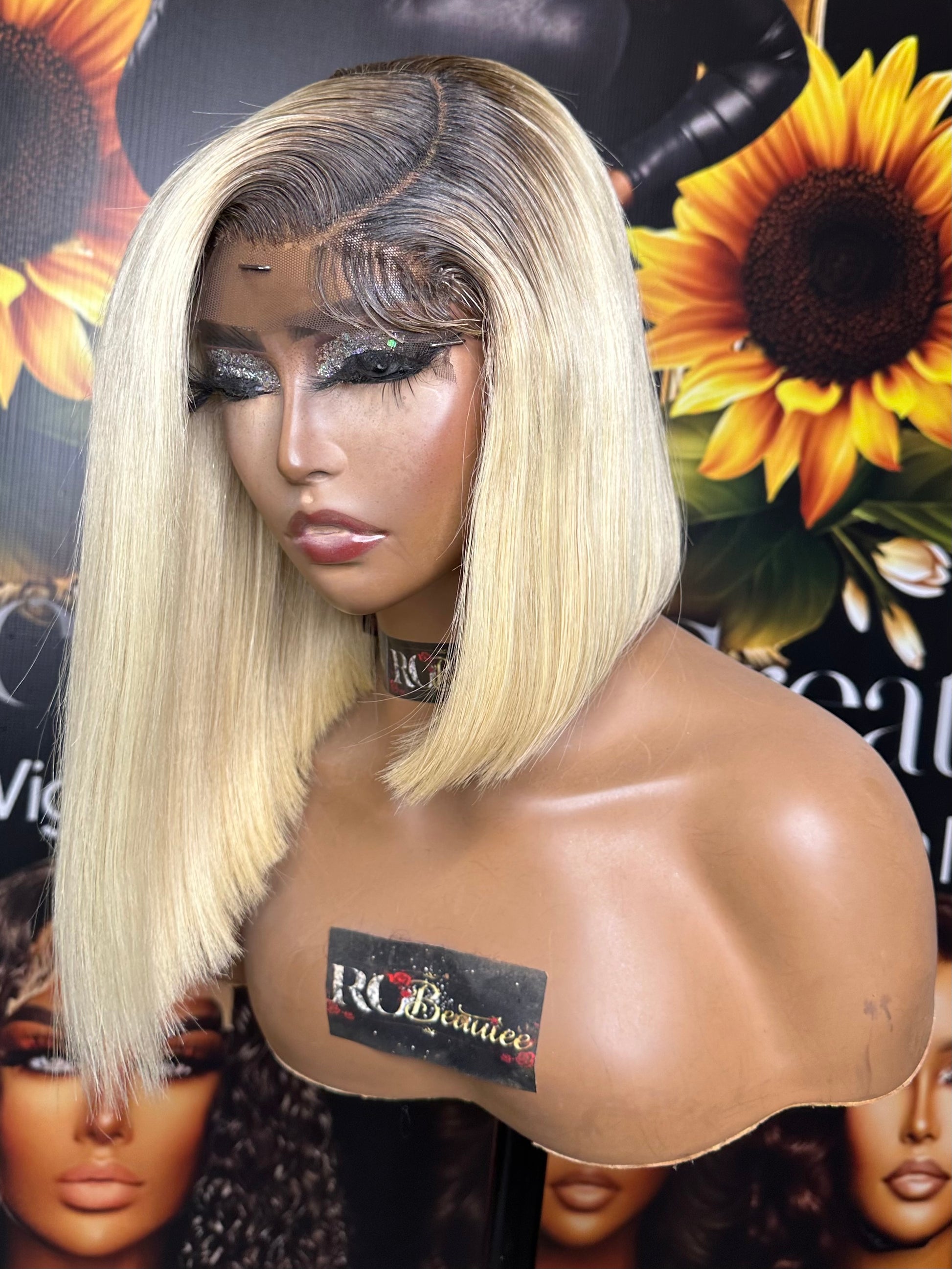 Blonde wig with dark roots.